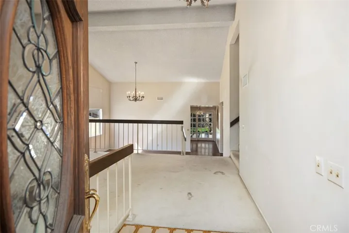 Expansive living room/dining room with cathedral ceilings could be opened up into kitchen/family room creating even more expansive open concept living.