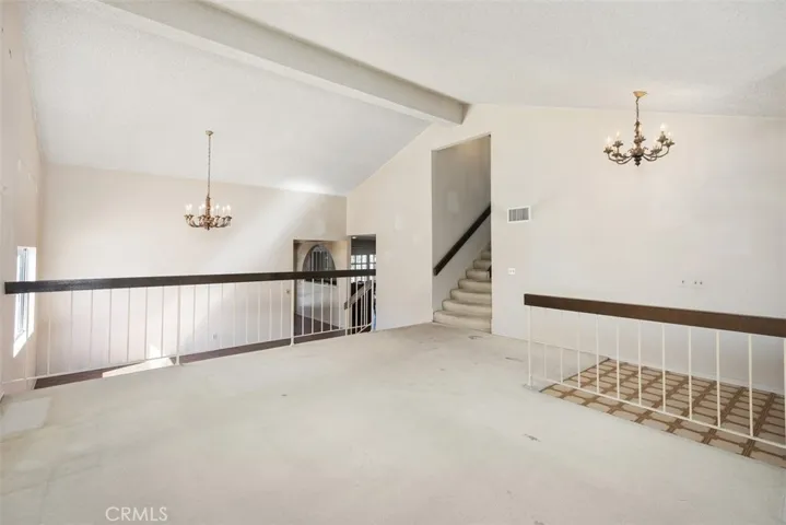 Expansive living room/dining room with cathedral ceilings could be opened up into kitchen/family room creating even more expansive open concept living.