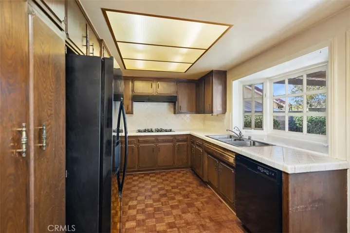 Expansive living room/dining room with cathedral ceilings could be opened up into kitchen/family room creating even more expansive open concept living.
