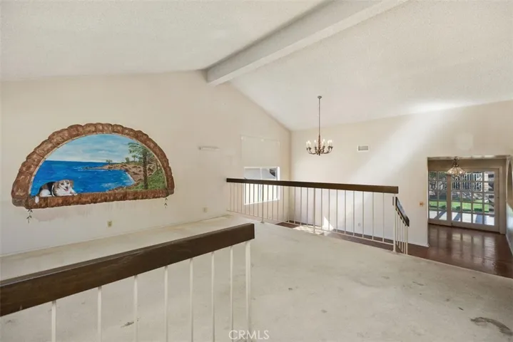 Expansive living room/dining room with cathedral ceilings could be opened up into kitchen/family room creating even more expansive open concept living.