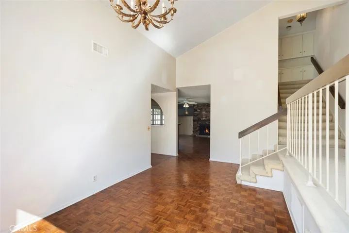 Expansive living room/dining room with cathedral ceilings could be opened up into kitchen/family room creating even more expansive open concept living.