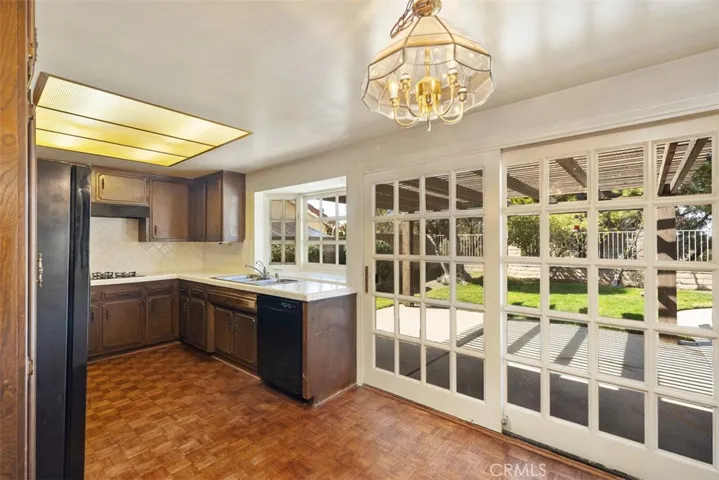 Expansive living room/dining room with cathedral ceilings could be opened up into kitchen/family room creating even more expansive open concept living.