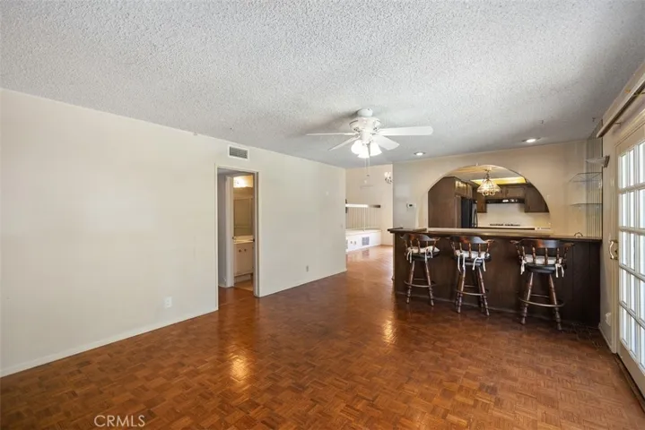 Expansive living room/dining room with cathedral ceilings could be opened up into kitchen/family room creating even more expansive open concept living.