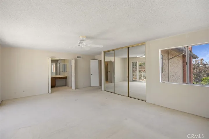 Owner's suite is expansive with en-suite, tons of closet space, and outside balcony.