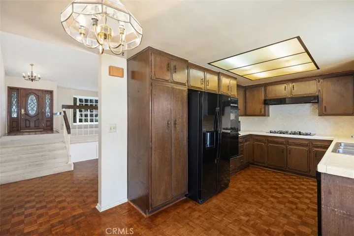 Expansive living room/dining room with cathedral ceilings could be opened up into kitchen/family room creating even more expansive open concept living.