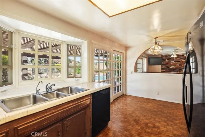 Expansive living room/dining room with cathedral ceilings could be opened up into kitchen/family room creating even more expansive open concept living.