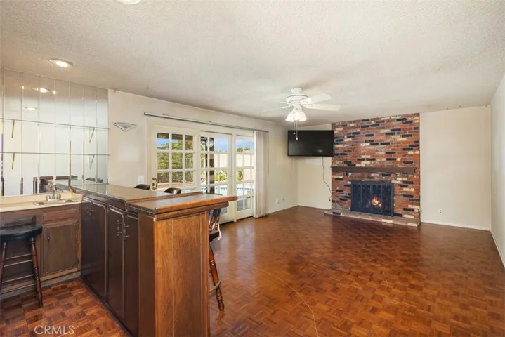 Expansive living room/dining room with cathedral ceilings could be opened up into kitchen/family room creating even more expansive open concept living.
