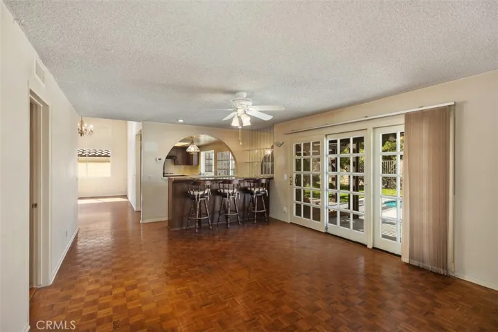 Expansive living room/dining room with cathedral ceilings could be opened up into kitchen/family room creating even more expansive open concept living.