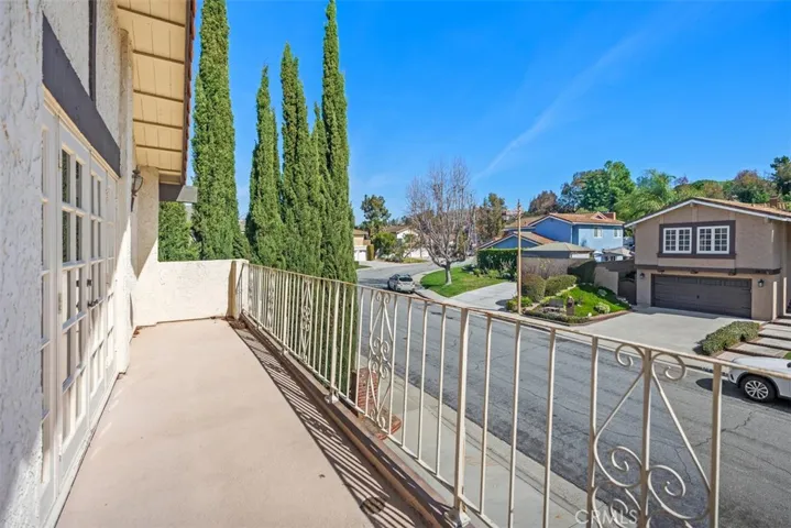 Owner's suite is expansive with en-suite, tons of closet space, and outside balcony.