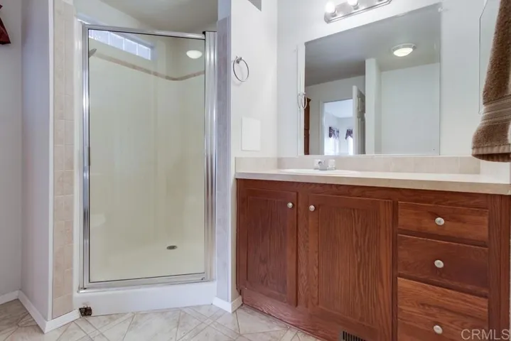 Primary Bathroom photo prior to new faucet and light fixture were added