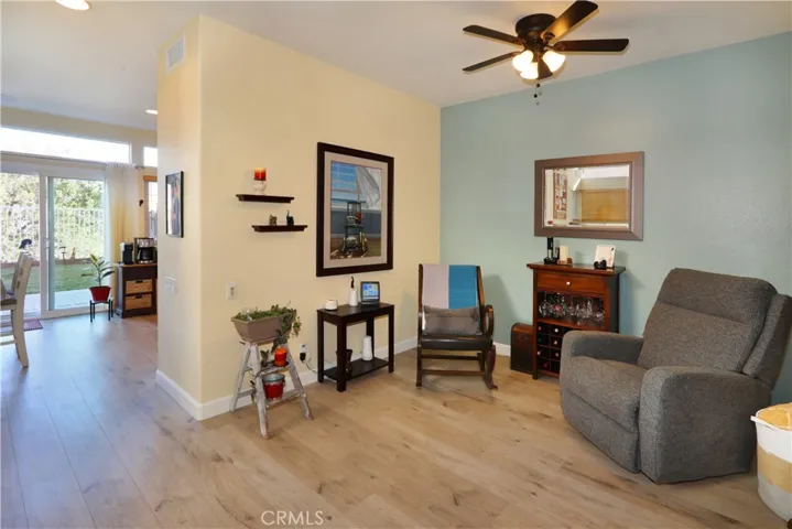 Formal dining area, used as a cozy den, connected to the living room.