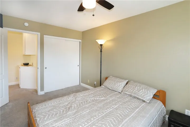 Bedroom #1, closet, view out to hallway with storage