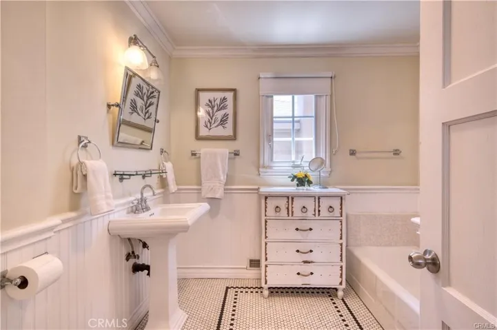 Main floor bathroom with tub and shower.