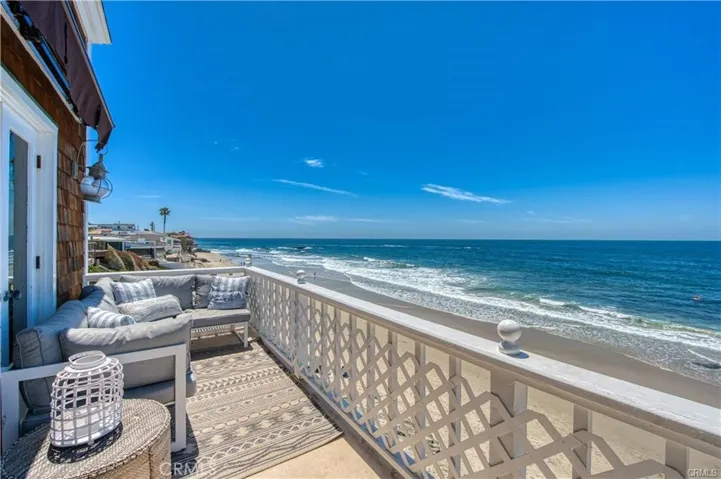 Main level deck with outdoor sectional and a spot to watch dolphins, surfers and beachgoers.