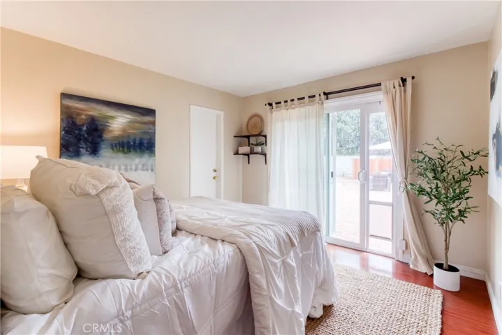 Bedroom #2 with a view of the backyard & a walk-in closet