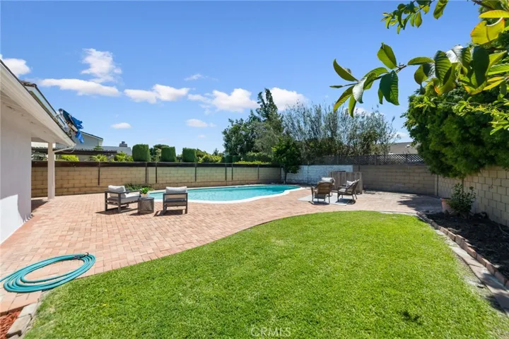 Thoughtfully designed backyard with a designated grass area