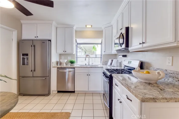 Kitchen features attractive granite countertops~