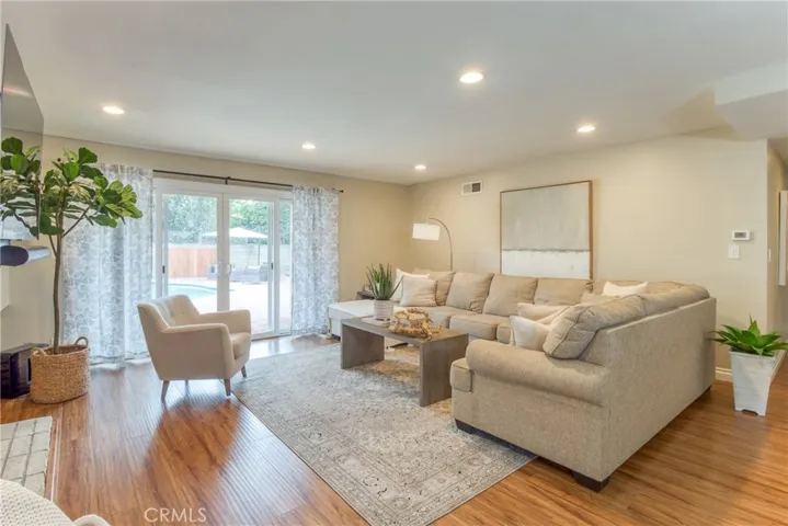 The Living room is enhanced by a view of the incredible backyard~