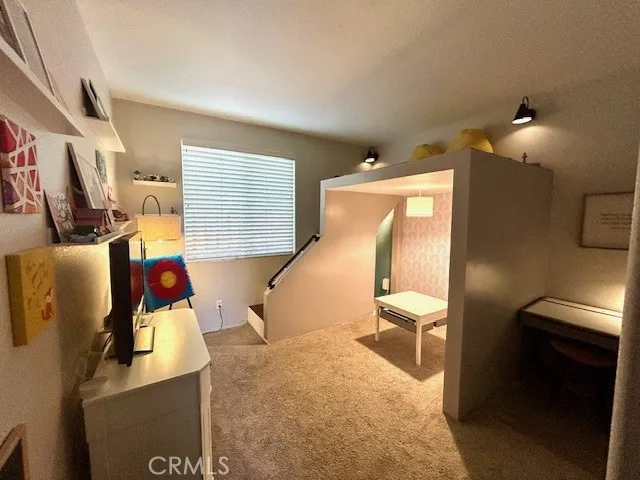 Bedroom with loft and hidden place under the stairs, railing has been added to the top and the staircase