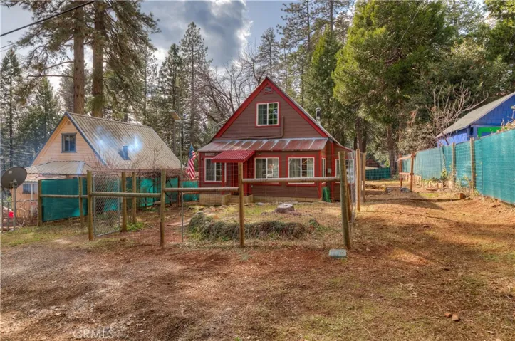 Front View of the Home with RV Parking area to the right.