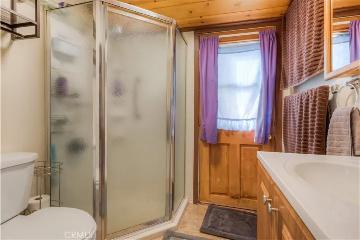 Down stairs bathroom with an exit out to the back yard.