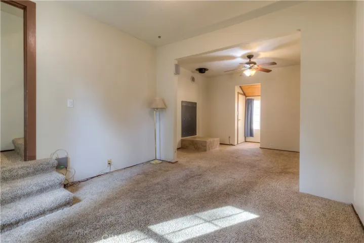 Side room off of the living room going up stairs.