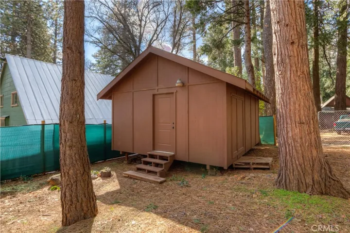 Large Shop/Shed with front entrance and side entrance.