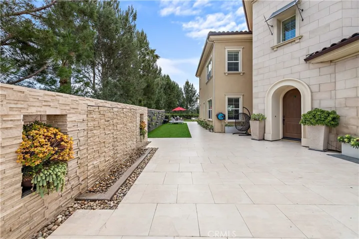 Front courtyard with a water wall.