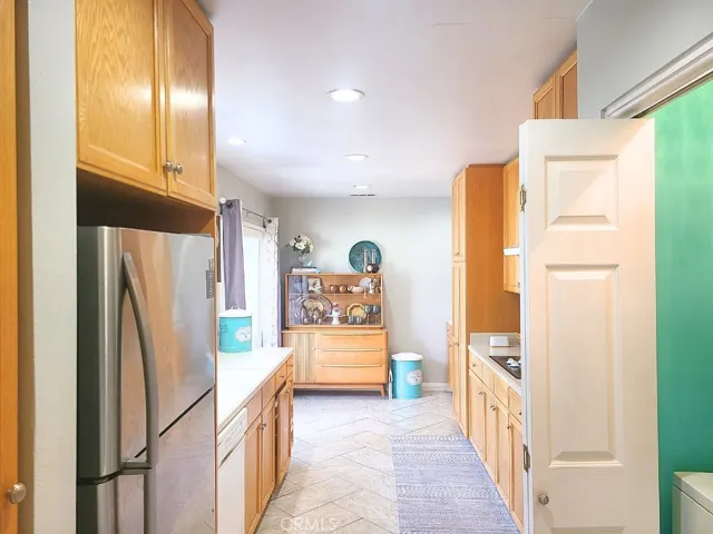 Galley kitchen with laundry closet