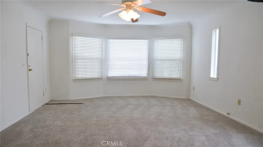 LIVING ROOM WITH LARGE WINDOWS AND BRAND NEW CARPET