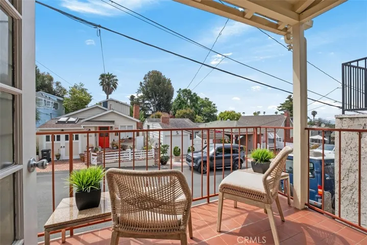 Enjoy a cup of coffee or glass of wine on back patio deck off on Lombardy lane.