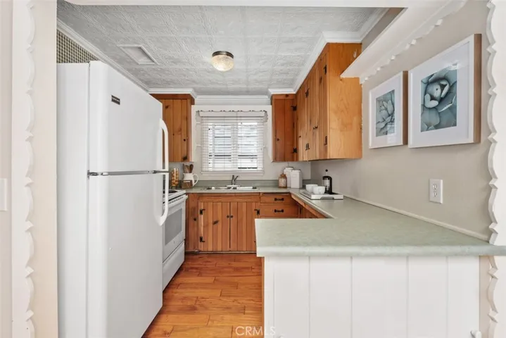 Vintage kitchen with original pine cabinetry.