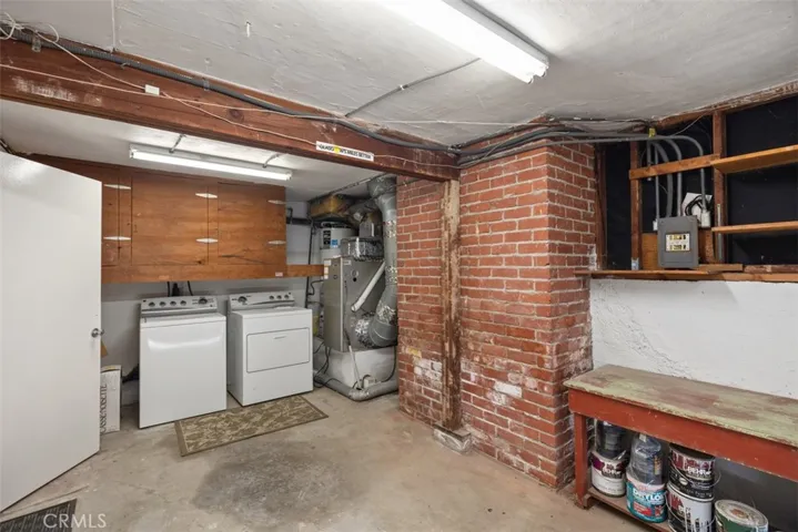Garage with laundry and ample storage space.