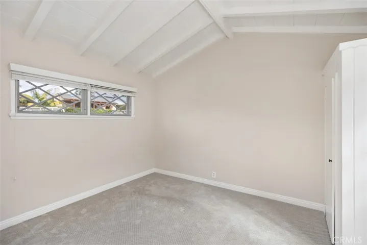 One of two main level bedrooms with built in closets not staged.