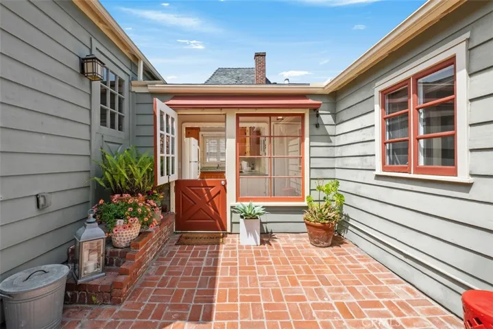 Enter the home thru a darling dutch door.