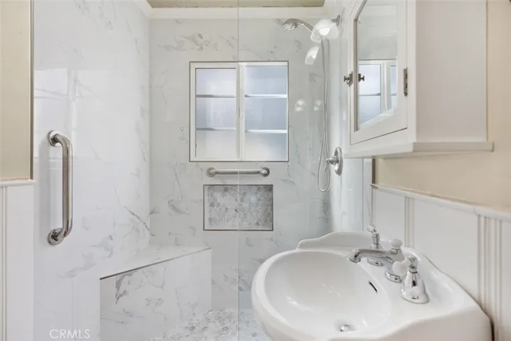 Main level bathroom with walk in shower.