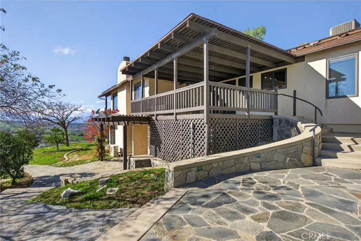 The upper balcony has direct access to the living areas and kitchen.