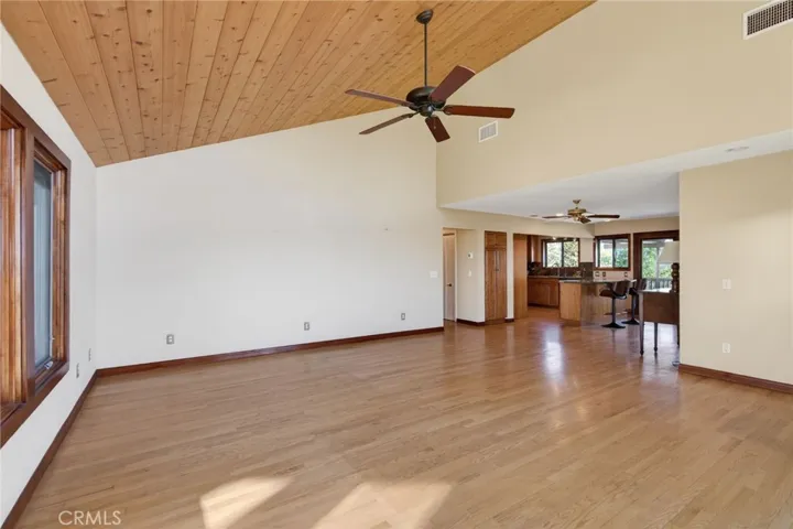 The family/dining room also has high ceilings and wood flooring.