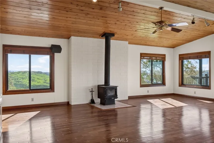 A quaint wood burning stove provides ambiance and heat.