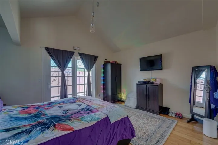 Downstairs bedroom #2 with separate patio access and pass-through bathroom connecting to hallway.  Perfect for separate renters and guests.