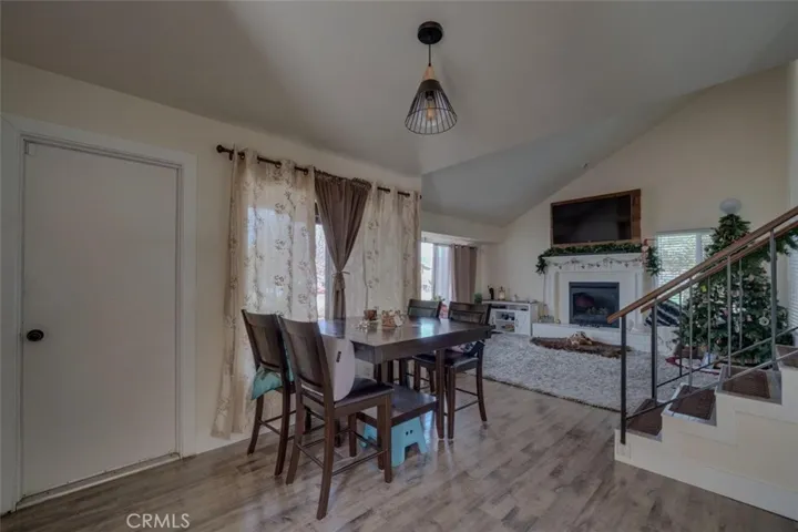 Dining area between kitchen and living room, with door to garage.