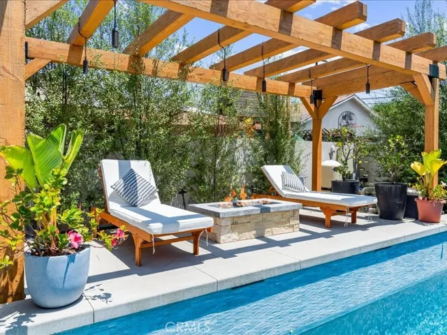 After a refreshing swim,warm up by your fire pit and enjoy the outside surround sound.