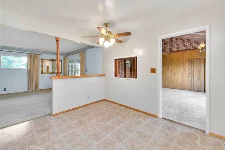 Facing dining nook, family room through doorway on the right and formal living room to the left