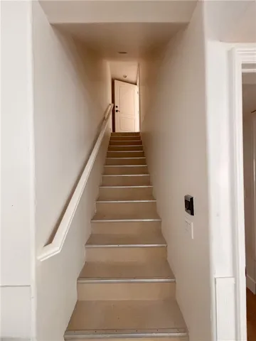 Steps leading from garage to upstairs unit