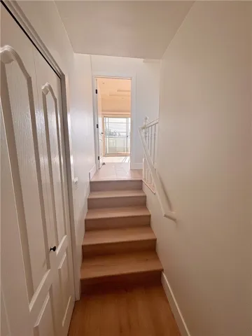 View to steps leading up to primary bedroom. Area to the right is the door to the sun deck