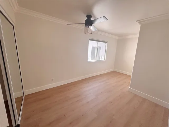 Secondary bedroom with ceiling fan
