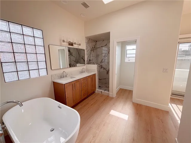 Lavish en suite bathroom view to walk-in shower and private commode