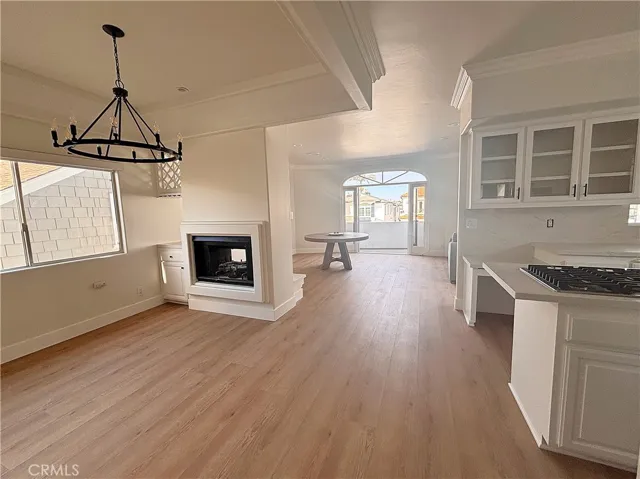 Dining room with see-through fireplace, view to living room and deck