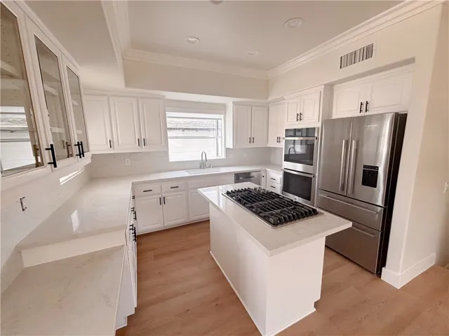 Kitchen includes refrigerator and microwave oven