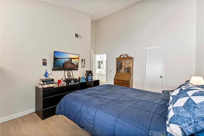 Suite to bathroom and walk-in closet. Vaulted ceilings.